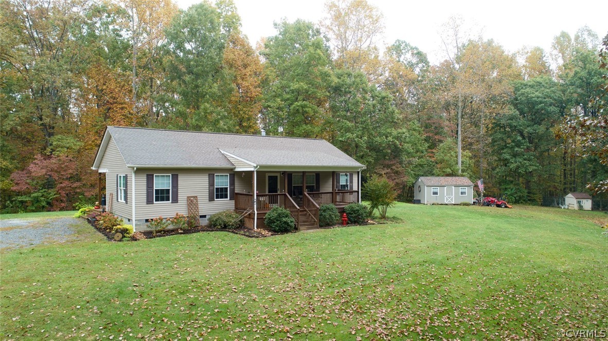 5764 Community House Road Columbia, VA 23038 - Photo 11 of 48 a front view of a house with garden