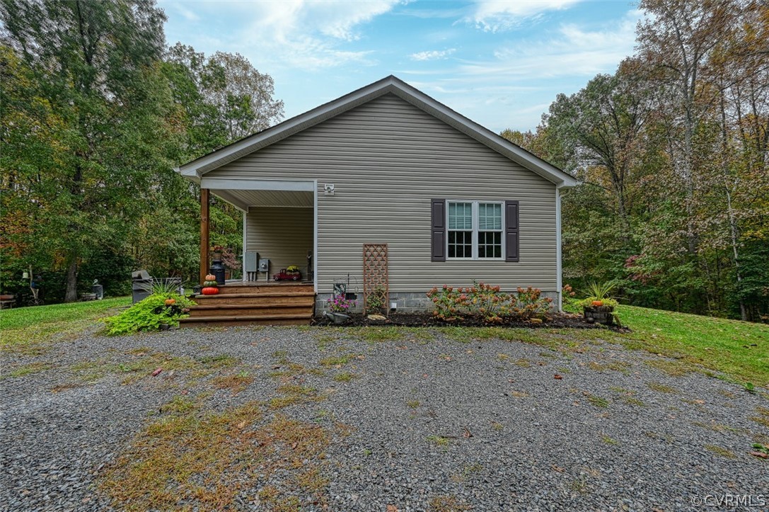 5764 Community House Road Columbia, VA 23038 - Photo 12 of 48 a view of a house with a yard and trees