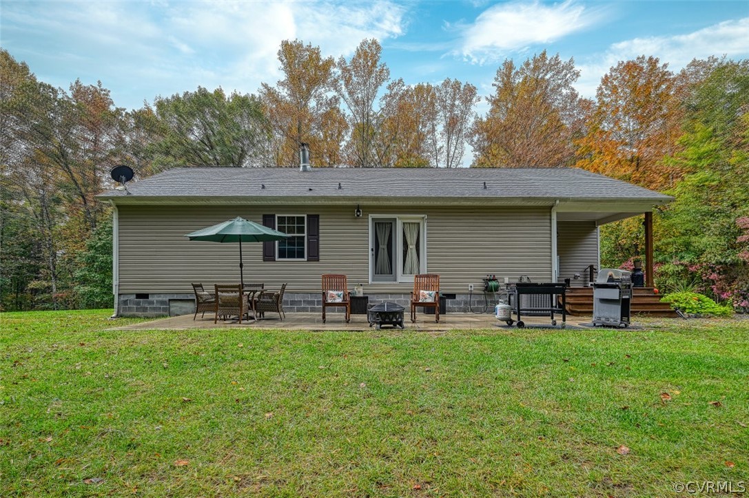 5764 Community House Road Columbia, VA 23038 - Photo 14 of 48 a view of a house with a yard and sitting area
