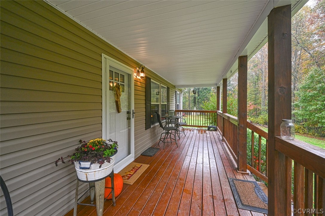 5764 Community House Road Columbia, VA 23038 - Photo 16 of 48 a view of a balcony with chairs