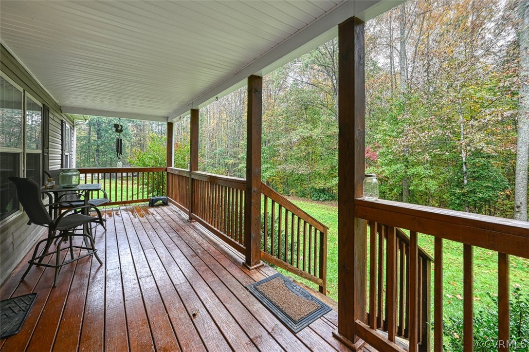 5764 Community House Road Columbia, VA 23038 - Photo 17 of 48 a view of balcony with wooden floor and fence