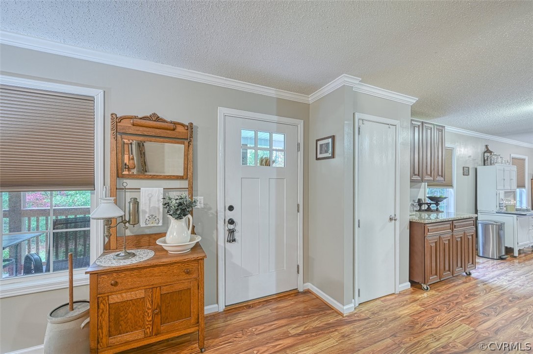 5764 Community House Road Columbia, VA 23038 - Photo 20 of 48 a room with stainless steel appliances wooden floors and wooden cabinets