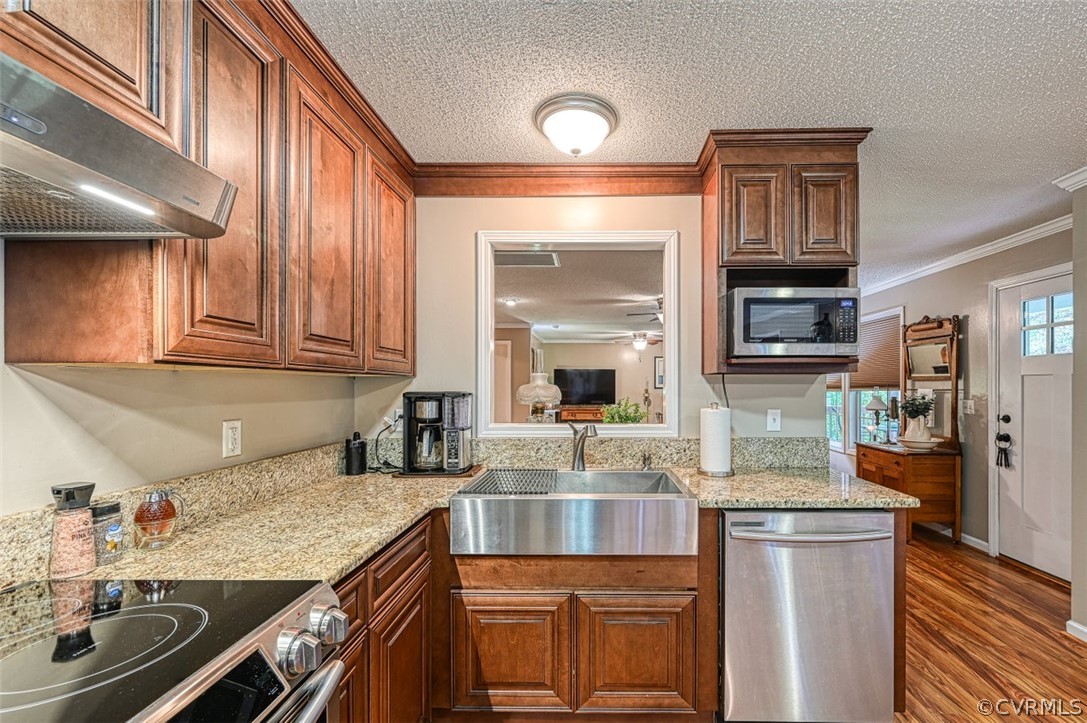 5764 Community House Road Columbia, VA 23038 - Photo 28 of 48 a kitchen with stainless steel appliances granite countertop a sink and cabinets