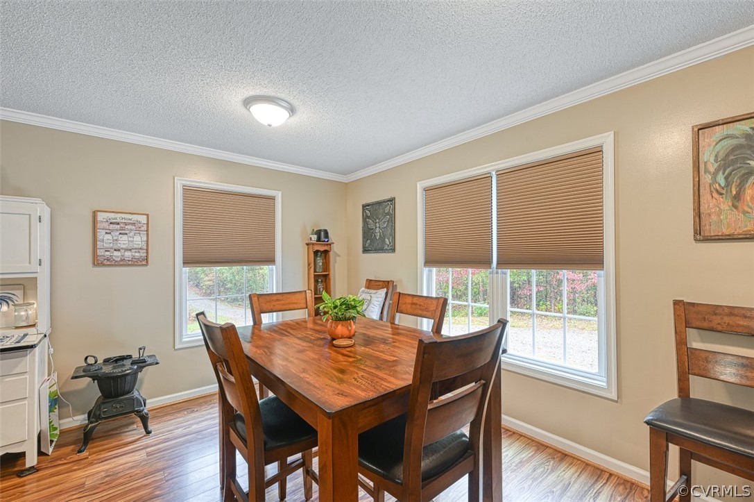 5764 Community House Road Columbia, VA 23038 - Photo 29 of 48 a view of a dining room with furniture window and wooden floor