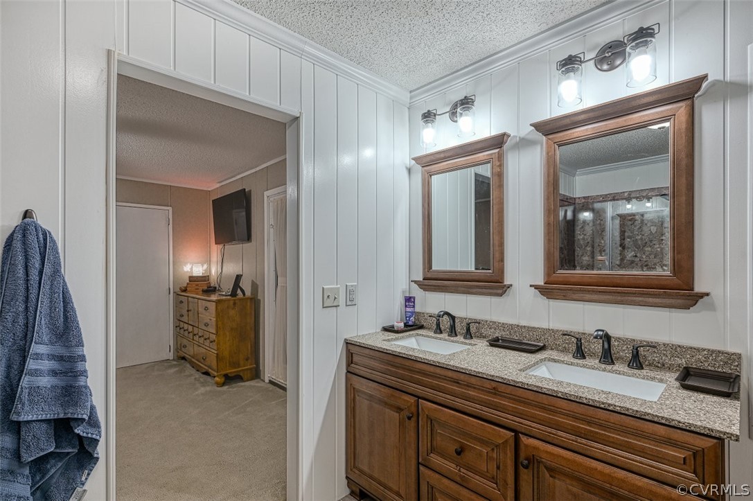 5764 Community House Road Columbia, VA 23038 - Photo 33 of 48 a bathroom with a sink double vanity and a mirror