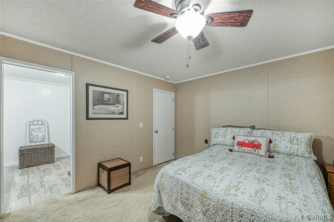 5764 Community House Road Columbia, VA 23038 - Photo 37 of 48 a bedroom with a bed and cabinets