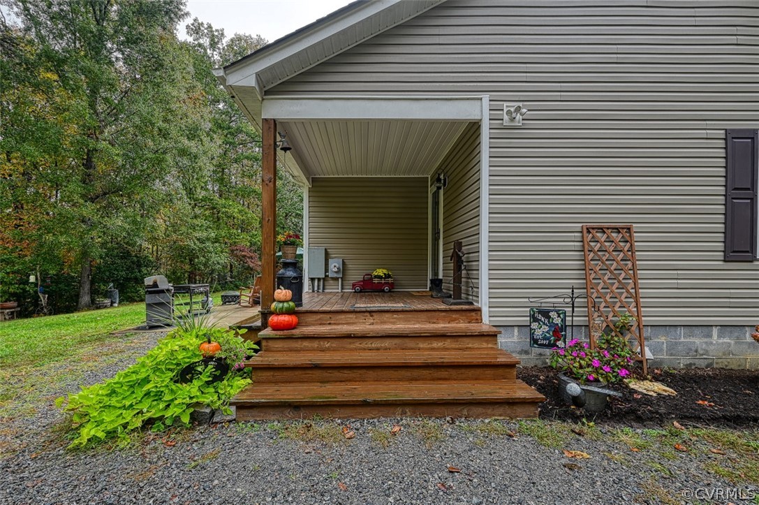 5764 Community House Road Columbia, VA 23038 - Photo 5 of 48 a view of a house with a yard and a garden