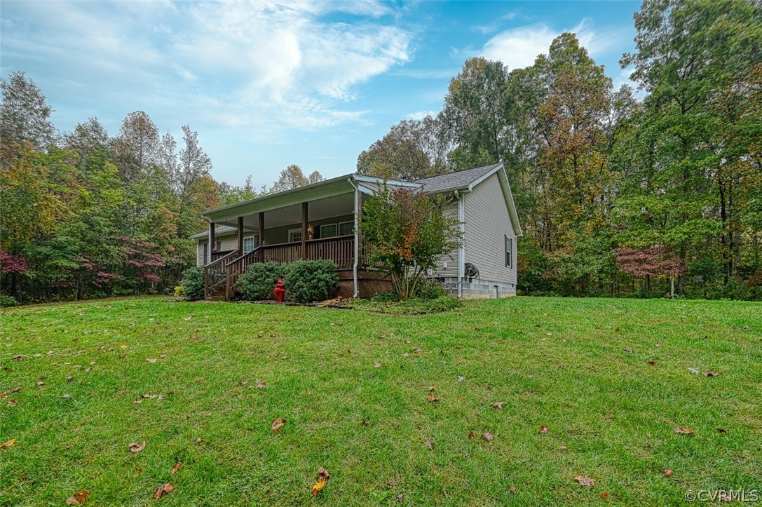 5764 Community House Road Columbia, VA 23038 - Photo 10 of 48 a view of a house with backyard and garden
