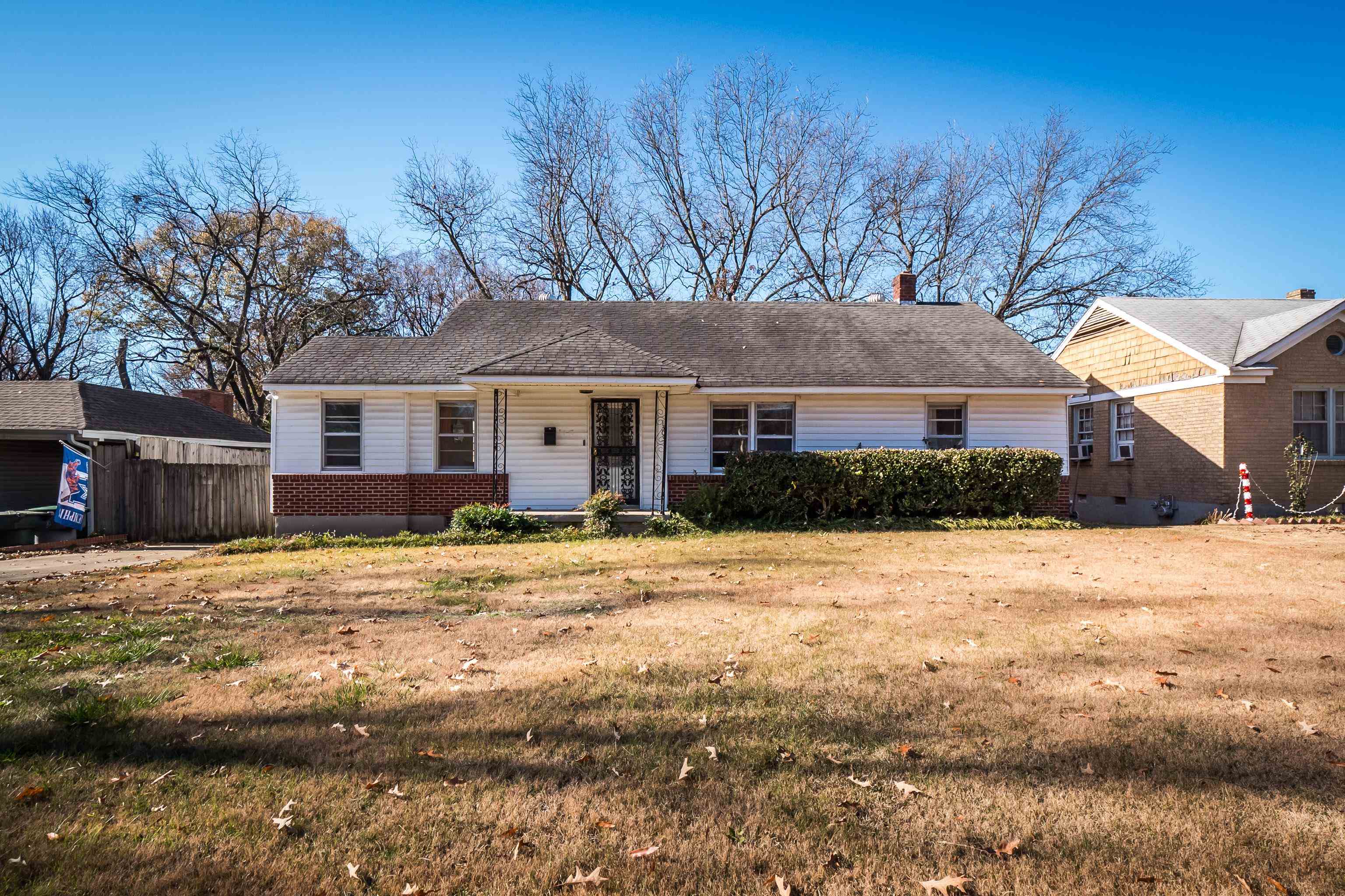 1303 Colonial Road Memphis, TN 38117 - Photo 1 of 38 a house that has a tree in front of it