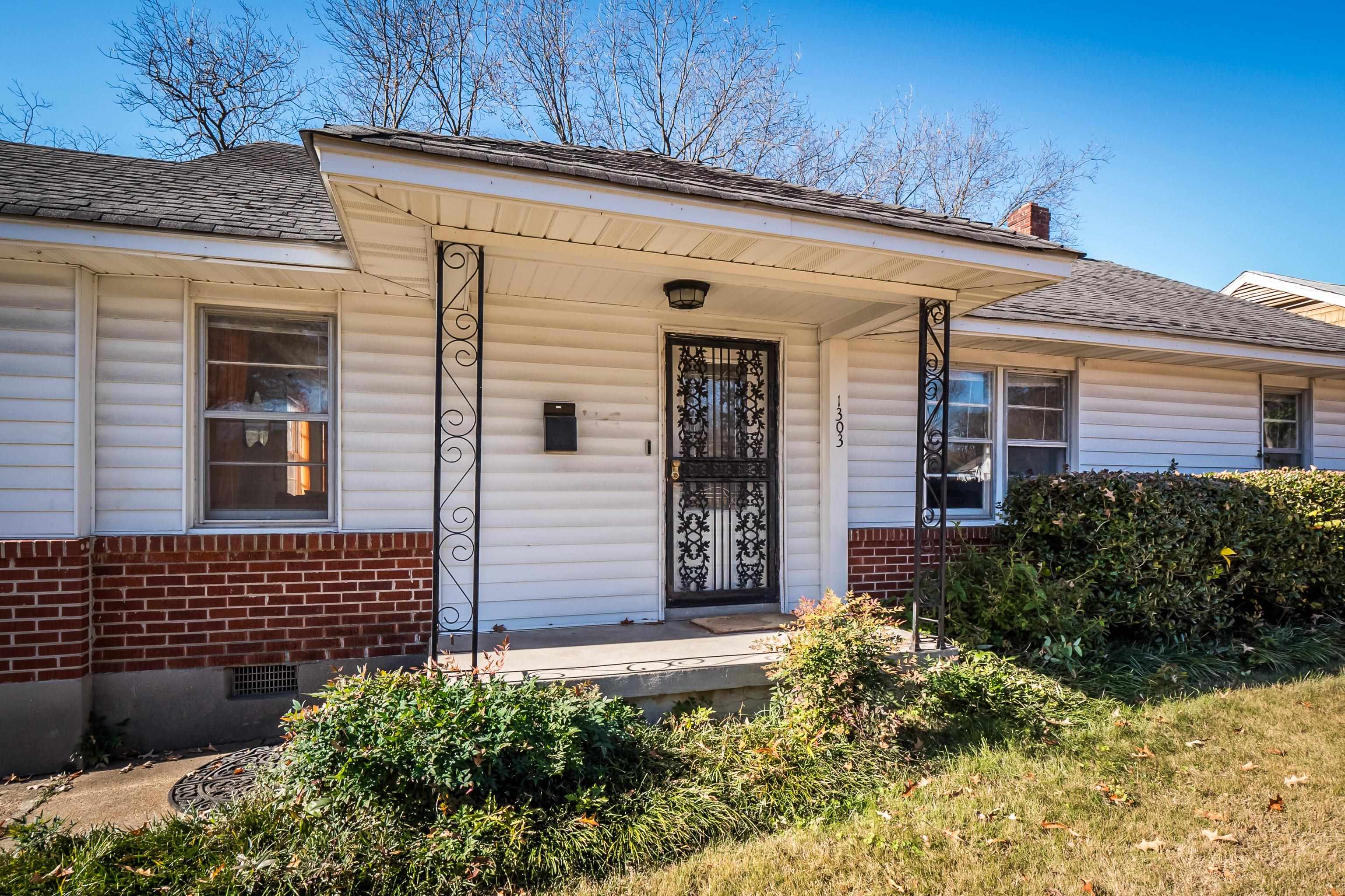 1303 Colonial Road Memphis, TN 38117 - Photo 3 of 38 a view of a house with potted plants