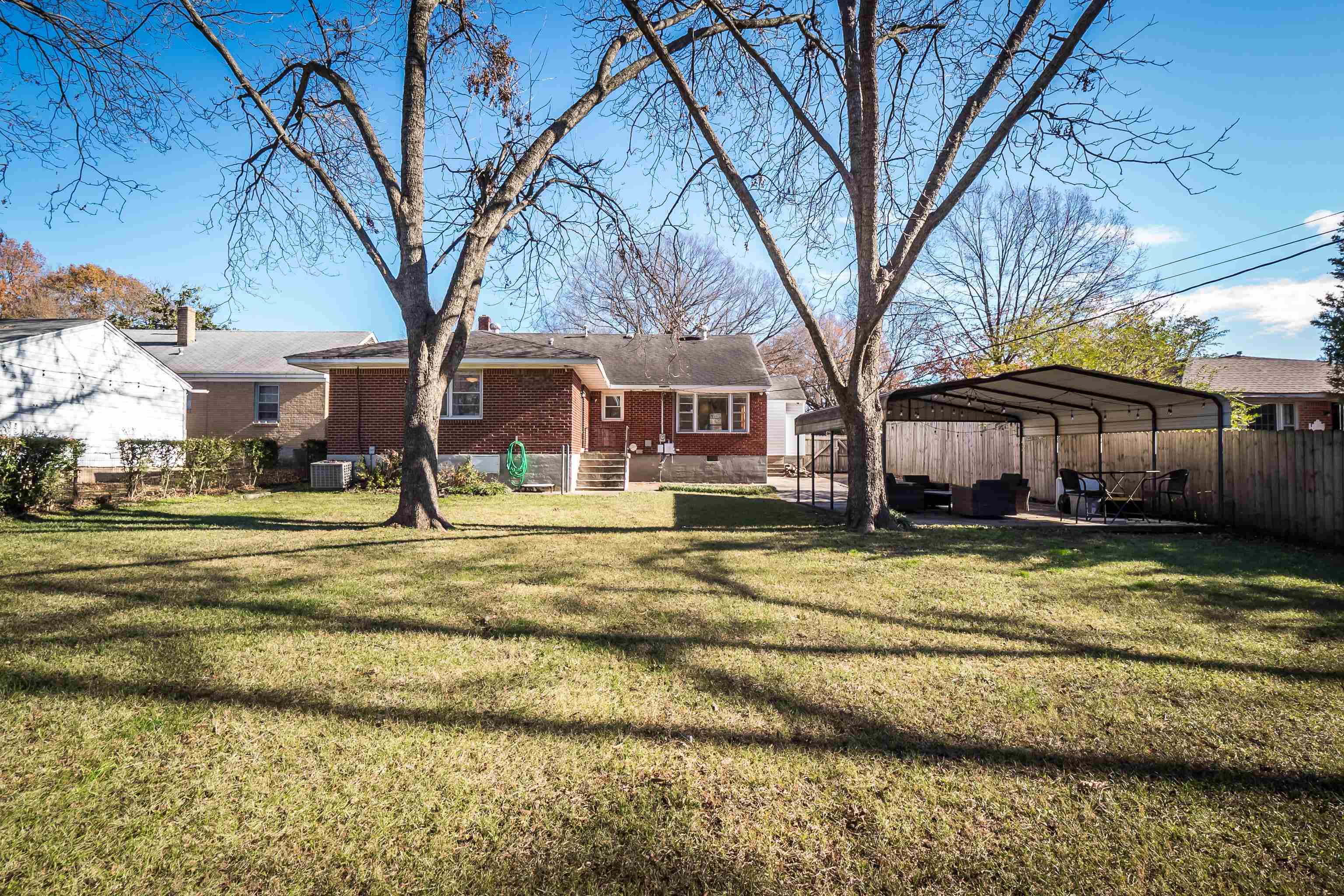 1303 Colonial Road Memphis, TN 38117 - Photo 33 of 38 a view of swimming pool with large trees and large tree