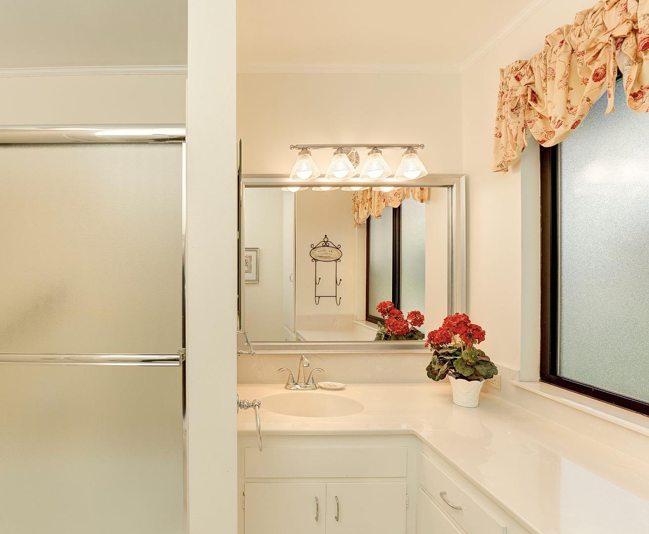 3084 Sloat Road Pebble Beach, CA 93953 - Photo 20 of 38 a bathroom with a sink and a mirror