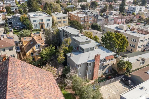 an aerial view of residential houses with outdoor space