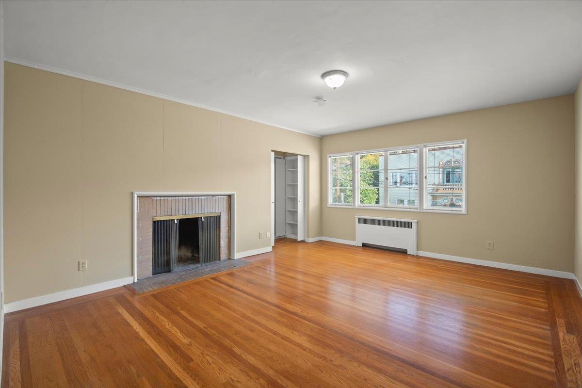 1526 Arch Street Berkeley, CA 94708 - Photo 14 of 27 a view of an empty room with a window and wooden floor
