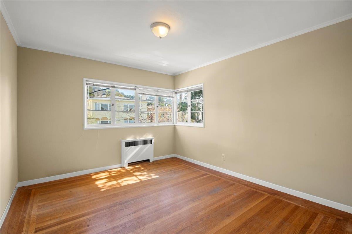 1526 Arch Street Berkeley, CA 94708 - Photo 15 of 27 a room with a wooden floor and window