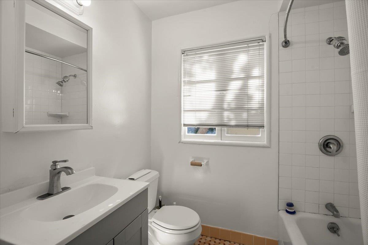 1526 Arch Street Berkeley, CA 94708 - Photo 22 of 27 a bathroom with a sink toilet a shower and a mirror