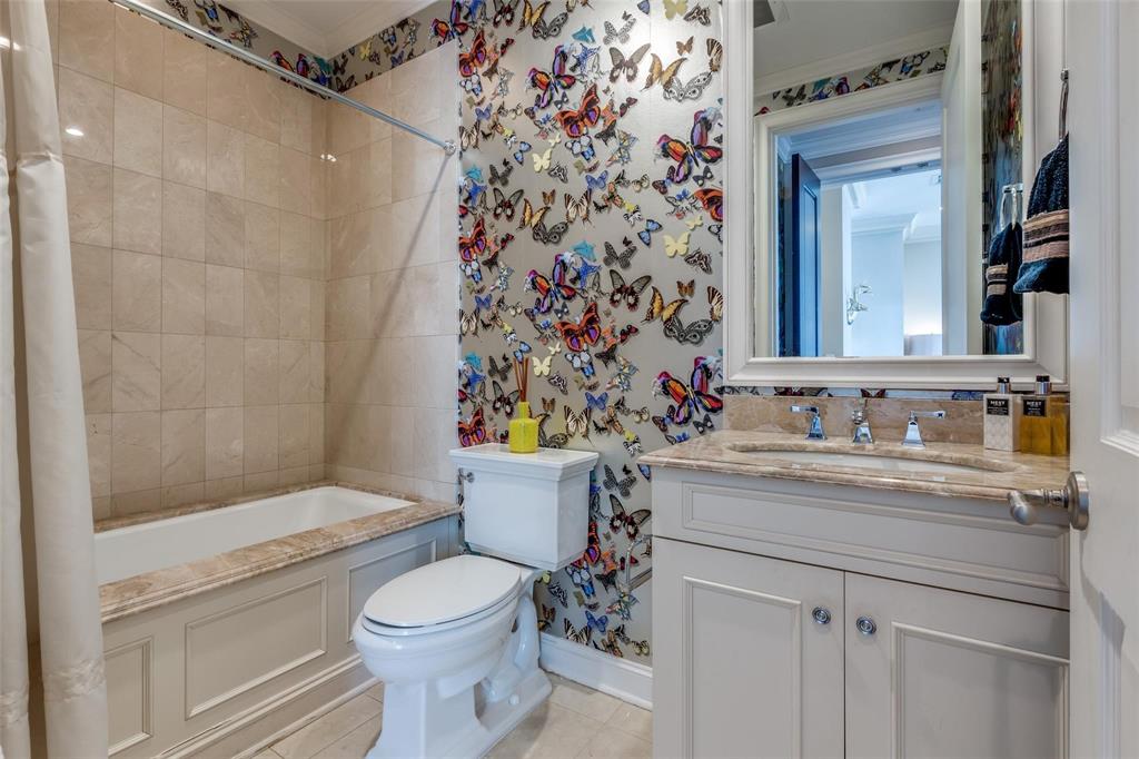2555 North Pearl Street, Unit 1402 Dallas, TX 75201 - Photo 17 of 25 a bathroom with a sink toilet and shower