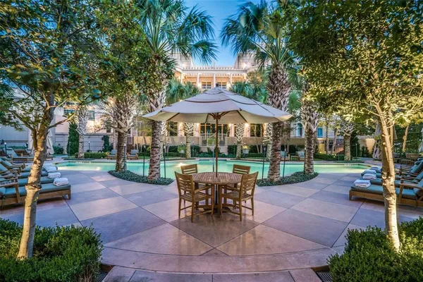 a patio with a garden and barbeque oven