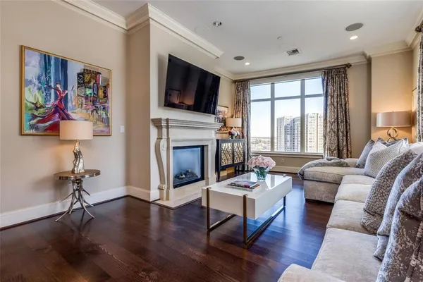 a living room with furniture fireplace and flat screen tv