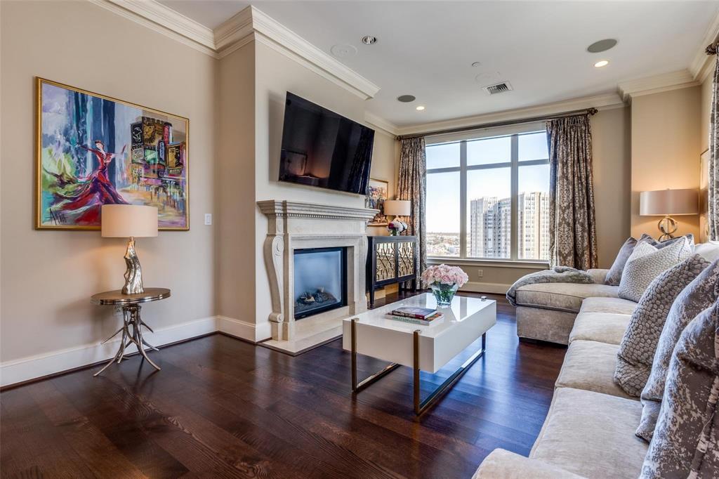 2555 North Pearl Street, Unit 1402 Dallas, TX 75201 - Photo 4 of 25 a living room with furniture fireplace and flat screen tv