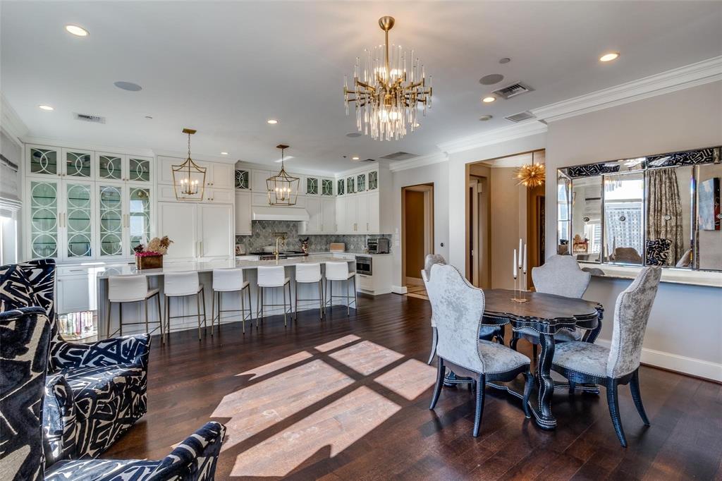 2555 North Pearl Street, Unit 1402 Dallas, TX 75201 - Photo 6 of 25 a view of a dining room with furniture a chandelier and wooden floor
