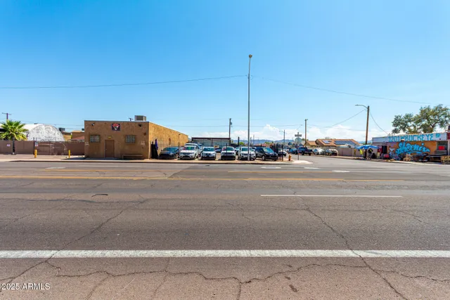a view of street with parked cars