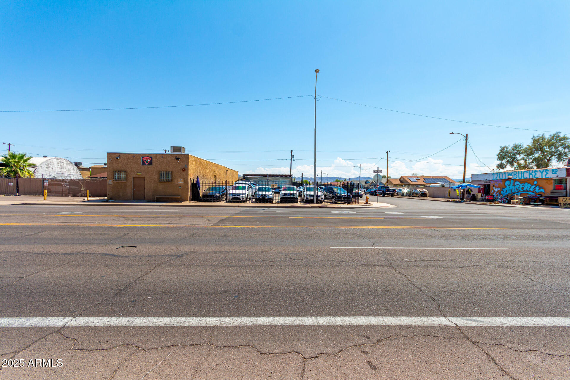 1117 West Buckeye Road, Unit 5 Phoenix, AZ 85007 - Photo 12 of 32 a car parked on the side of the road