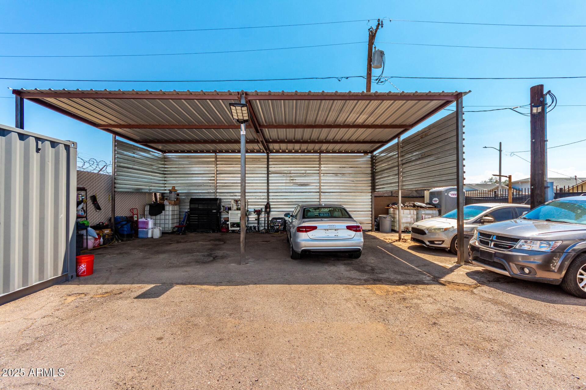 1117 West Buckeye Road, Unit 5 Phoenix, AZ 85007 - Photo 14 of 32 a view of parking garage with cars