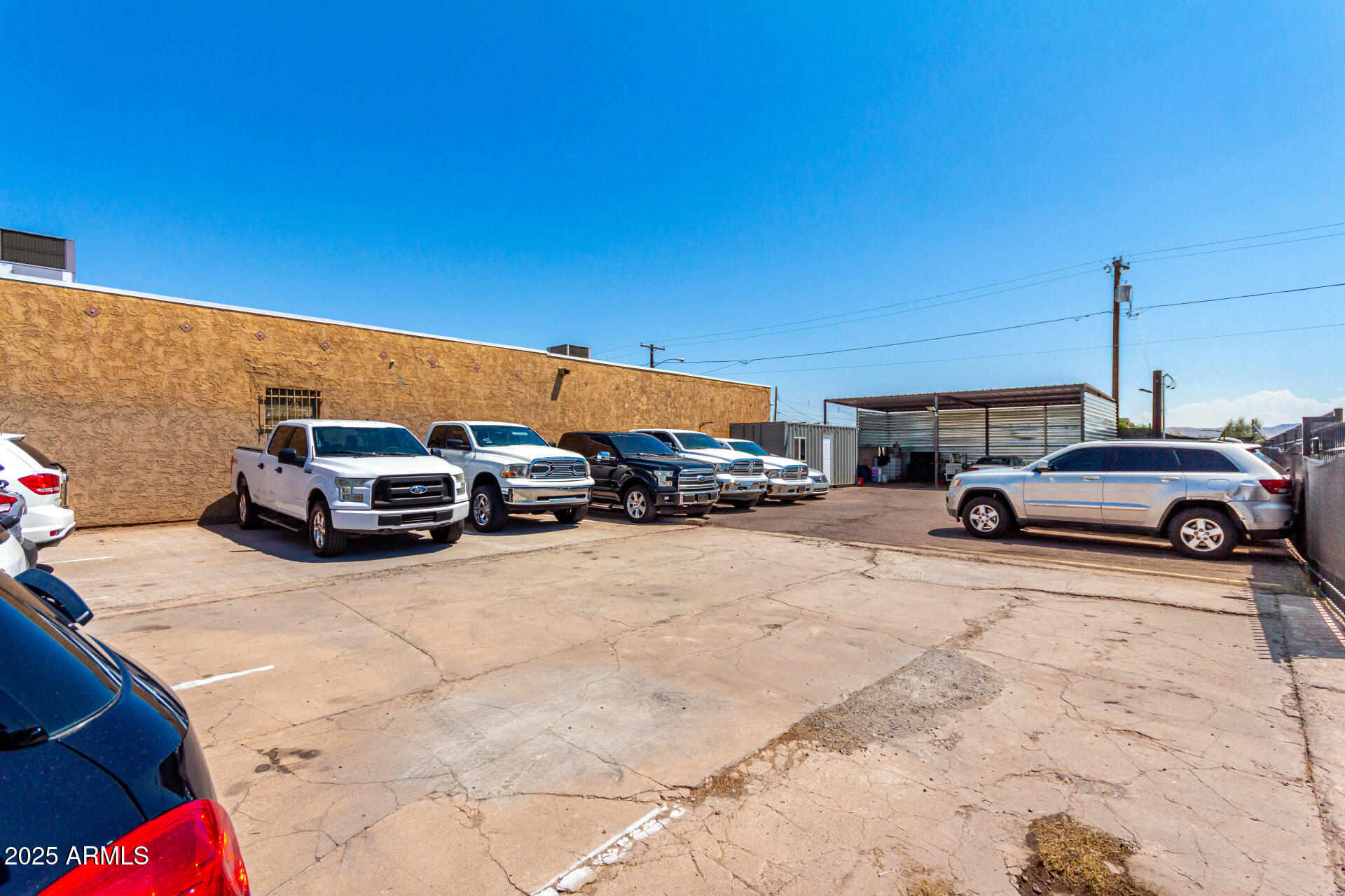 1117 West Buckeye Road, Unit 5 Phoenix, AZ 85007 - Photo 19 of 32 a view of car parked in parking lot