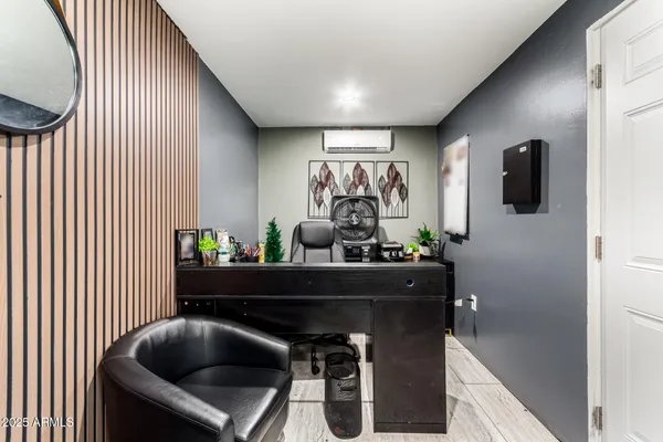 a room with a chair and a large window