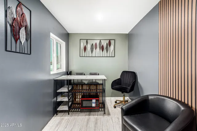 a bedroom with furniture and a rug