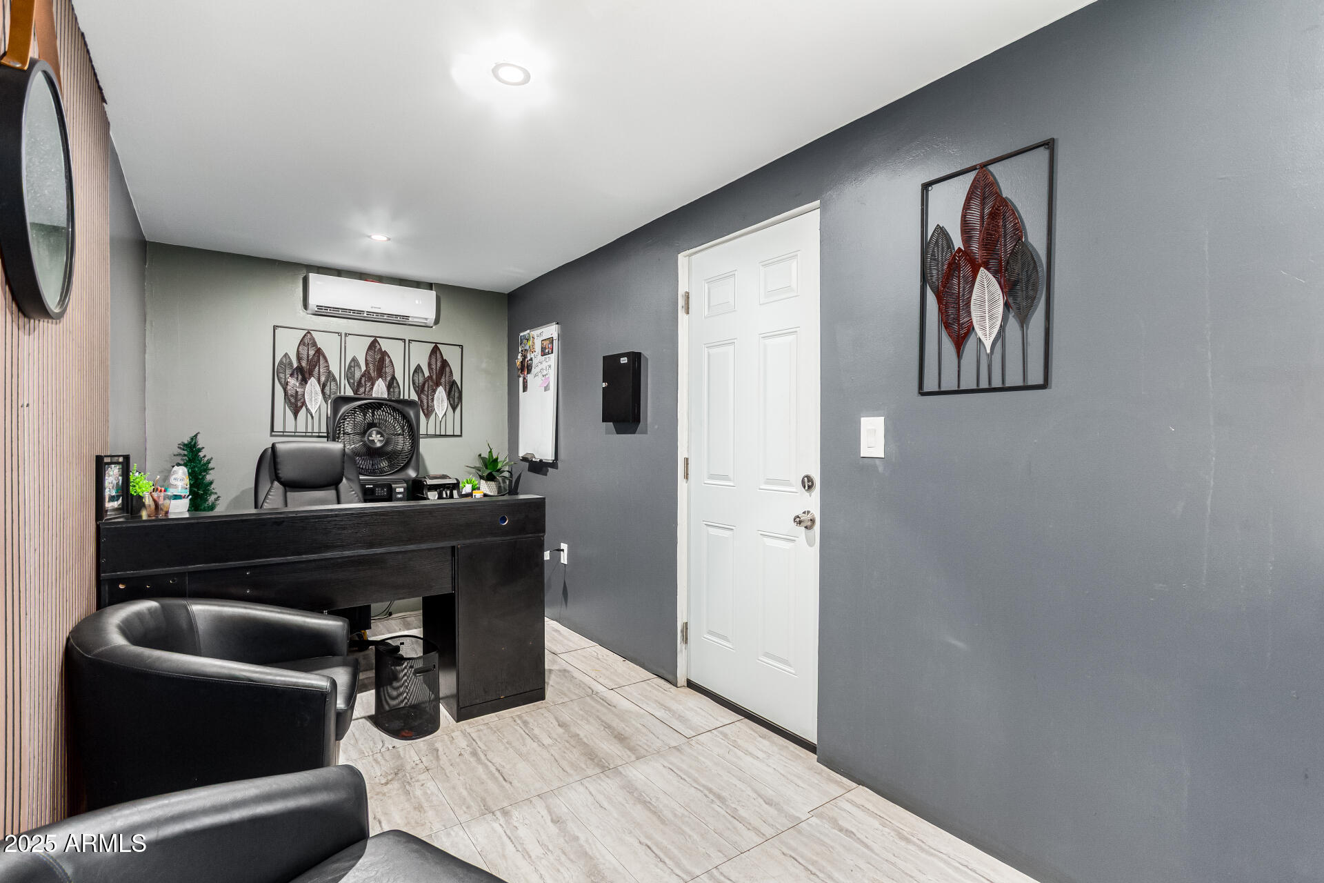 1117 West Buckeye Road, Unit 5 Phoenix, AZ 85007 - Photo 24 of 32 a living room with furniture and a chandelier
