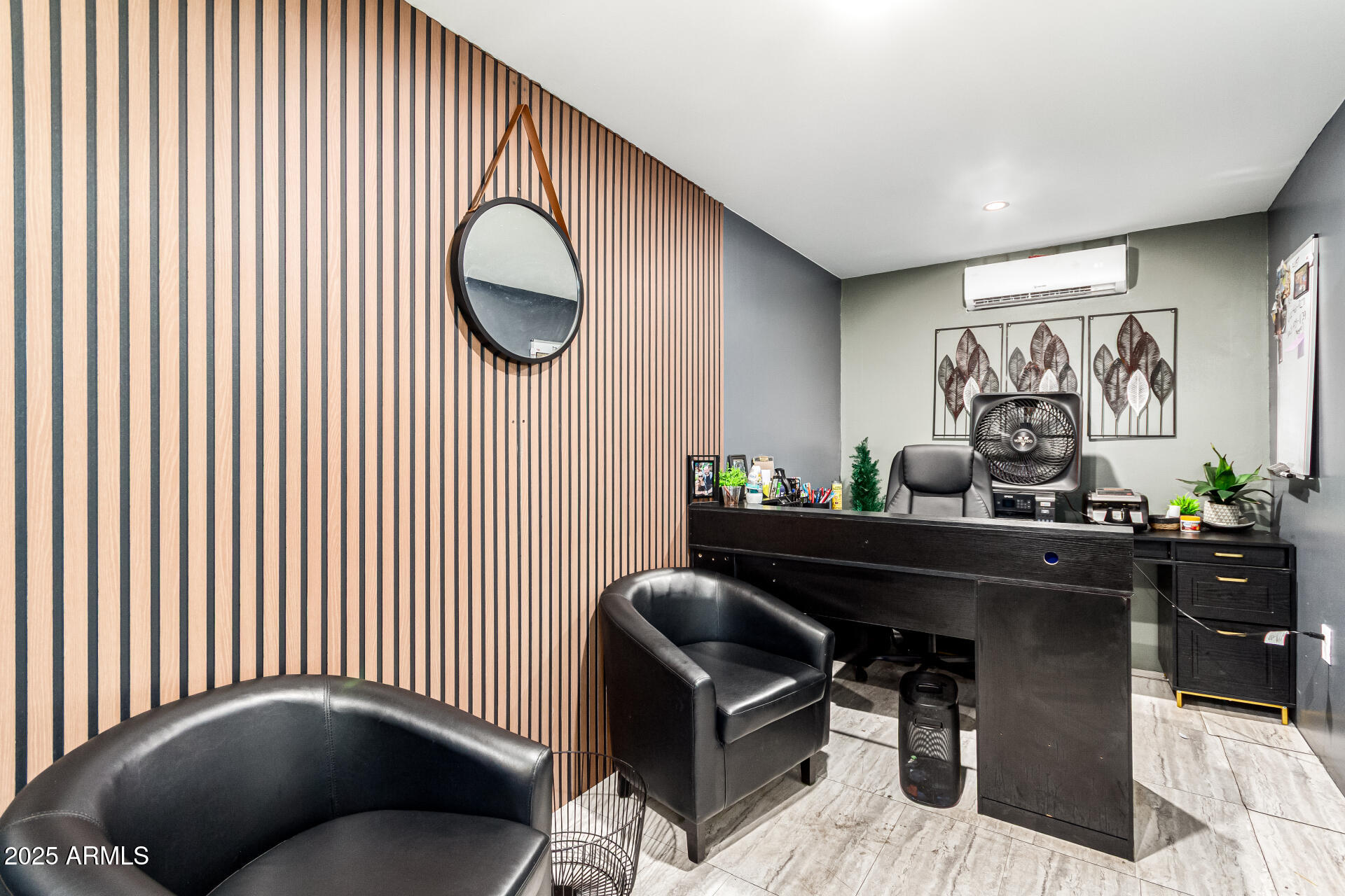 1117 West Buckeye Road, Unit 5 Phoenix, AZ 85007 - Photo 25 of 32 a living room with furniture and a potted plant