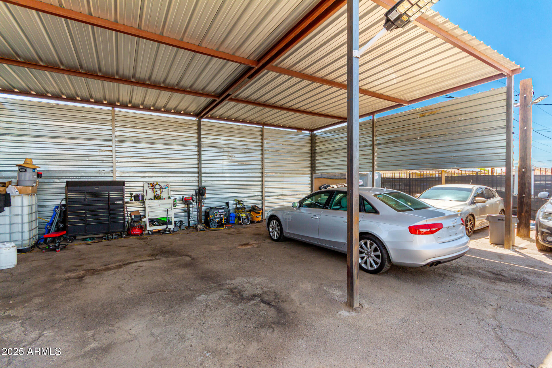 1117 West Buckeye Road, Unit 5 Phoenix, AZ 85007 - Photo 4 of 32 a car is parked in a garage