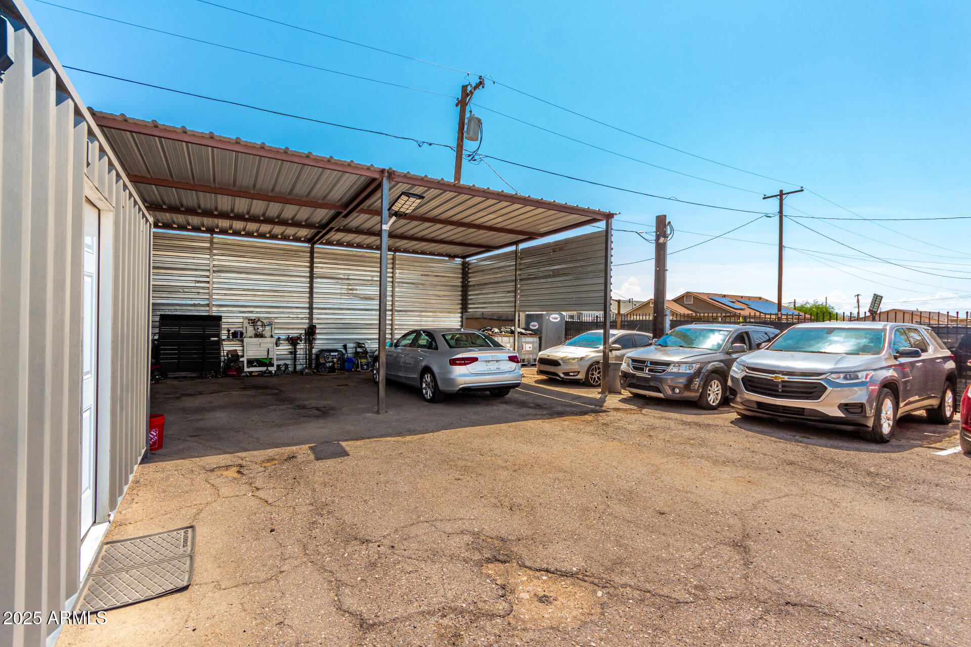 1117 West Buckeye Road, Unit 5 Phoenix, AZ 85007 - Photo 5 of 32 a view of parking garage with cars parked