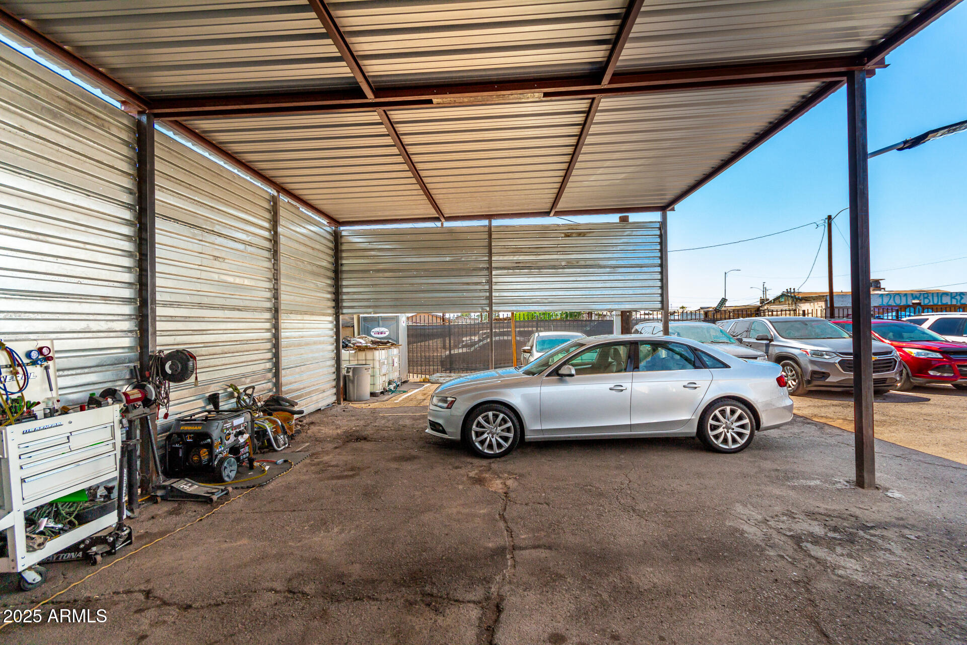 1117 West Buckeye Road, Unit 5 Phoenix, AZ 85007 - Photo 8 of 32 a view of parking garage with cars