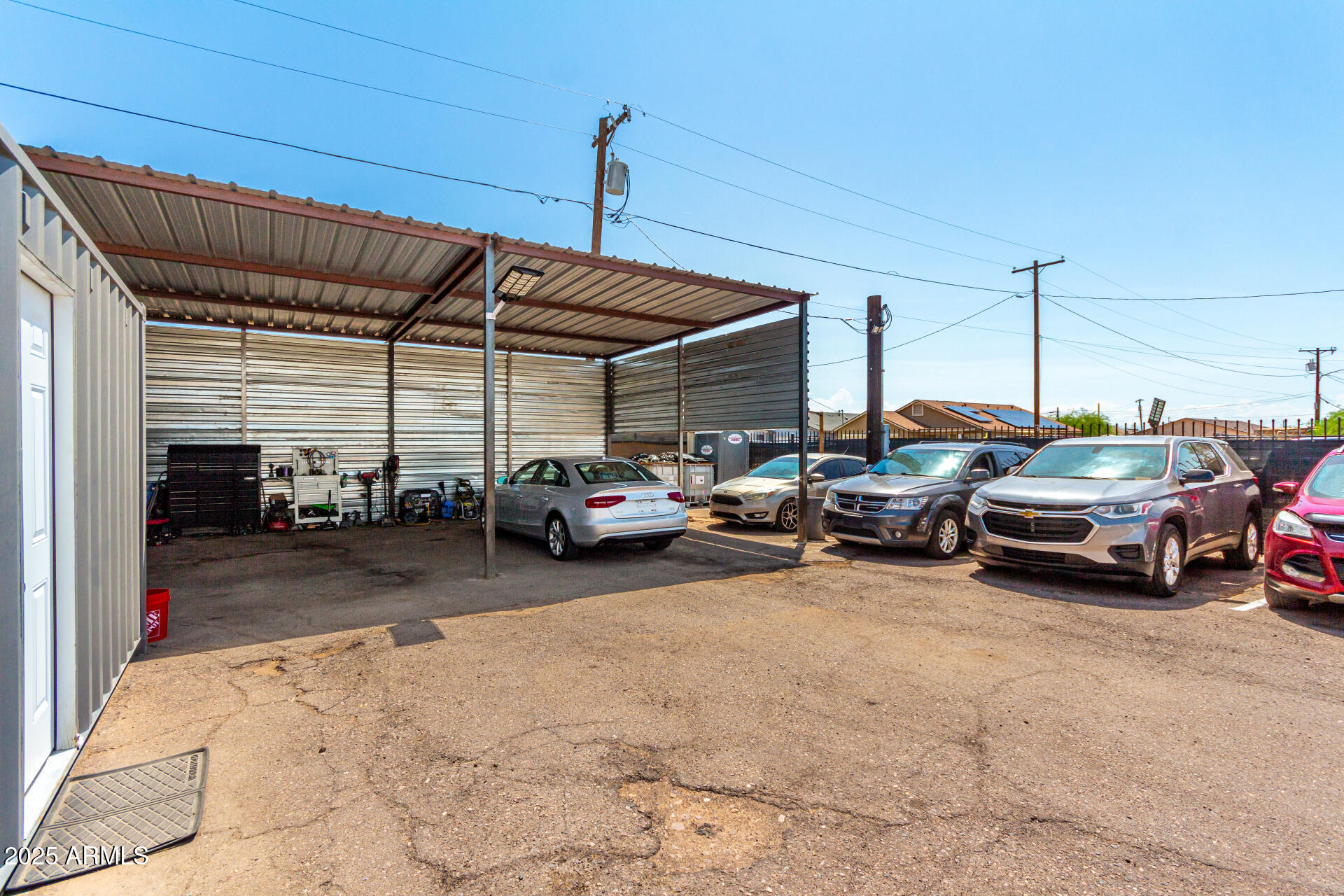 1117 West Buckeye Road, Unit 5 Phoenix, AZ 85007 - Photo 9 of 32 a view of cars parked in a parking