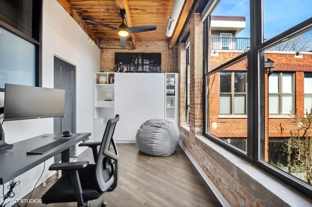 2222 North Racine Avenue, Unit 16 Chicago, IL 60614 - Photo 20 of 32 a workspace with furniture and a large window