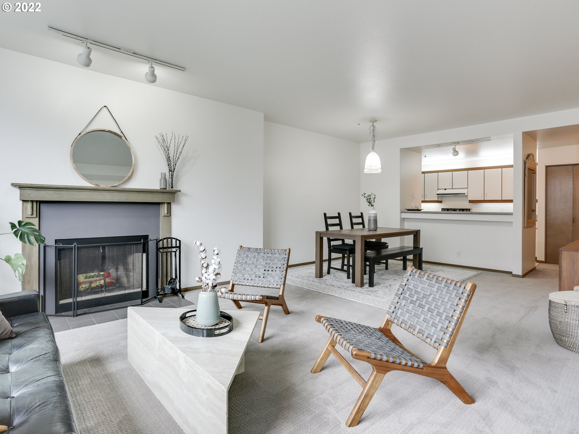 1730 South Harbor Way, Unit 405 Portland, OR 97201 - Photo 5 of 32 a living room with furniture and a fireplace