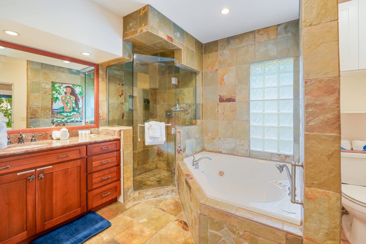 366 Papaloa Road, Unit 114 Kapaa, HI 96746 - Photo 8 of 23 a bathroom with a tub sink shower and mirror