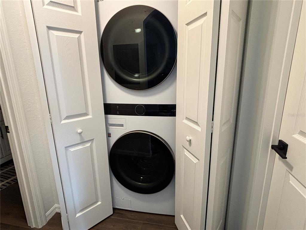 8809 Manor Loop, Unit 202 Lakewood Ranch, FL 34202 - Photo 6 of 9 a close up view of a washer and dryer