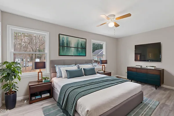 a bathroom with a bathtub a sink a toilet and a mirror