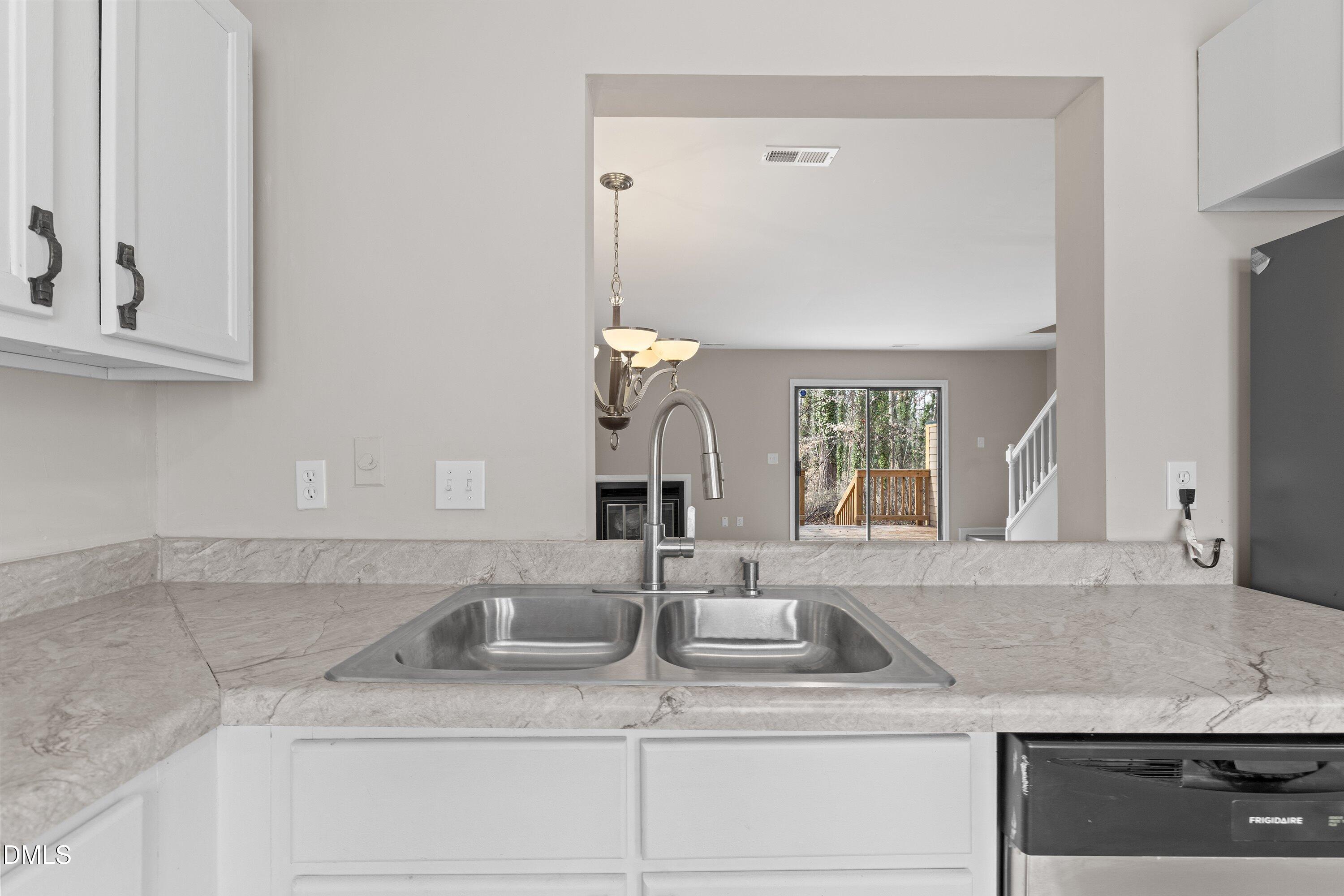 887 Dalewood Drive Raleigh, NC 27610 - Photo 8 of 21 a bathroom with a sink and a mirror