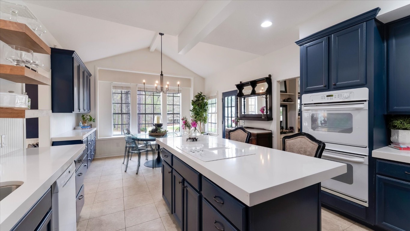 100 Lords Circle Coldspring, TX 77331 - Photo 17 of 50 a kitchen with granite countertop a sink appliances and cabinets
