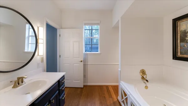 a view of a hallway with furniture and closet
