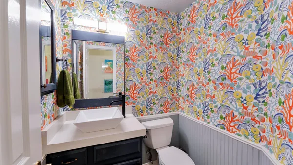 a view of a house with pool and trees