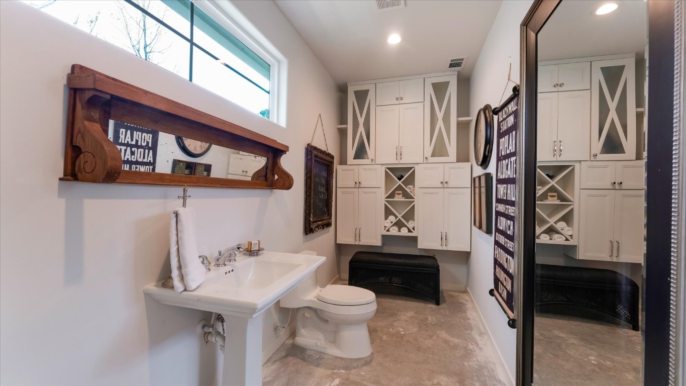 100 Lords Circle Coldspring, TX 77331 - Photo 41 of 50 a bathroom with a sink a toilet and a mirror