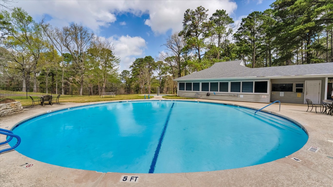 100 Lords Circle Coldspring, TX 77331 - Photo 48 of 50 a view of a house with pool and trees