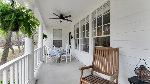 a view of a patio with iron fence