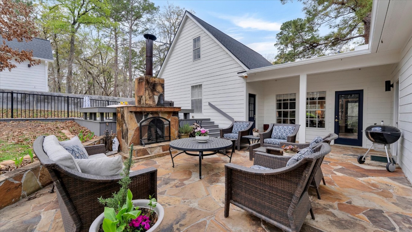 100 Lords Circle Coldspring, TX 77331 - Photo 10 of 50 a patio with patio a couch and chairs